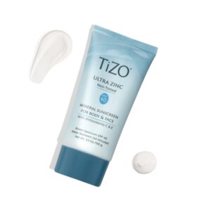 Blue product bottle with product spread to show smooth consistency